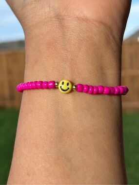 Pink Beaded Bracelet with Yellow Smile Charm